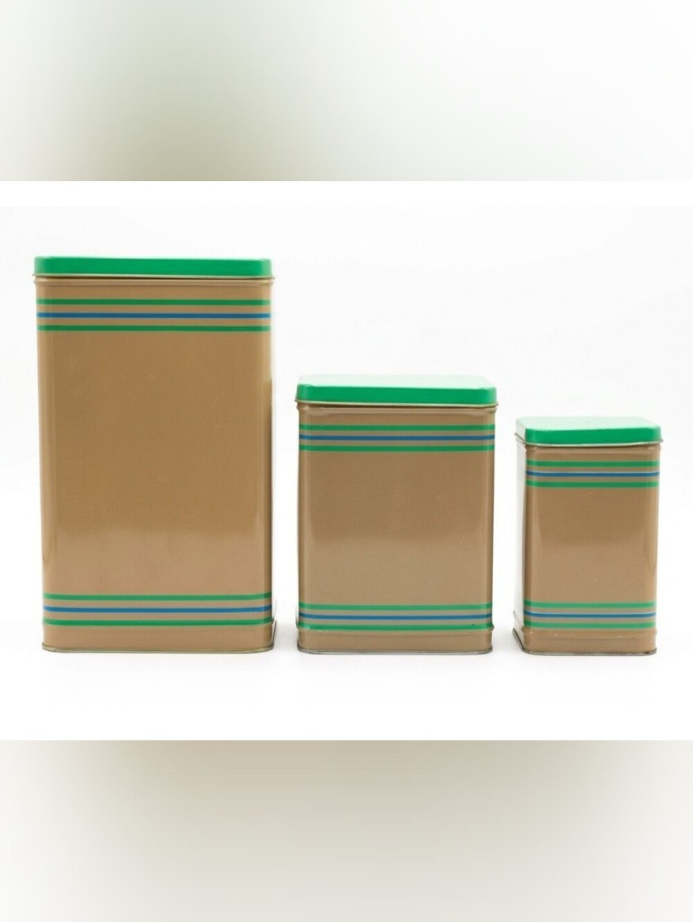 LASLO - Set of 3 Nesting Tan Metal Canisters with Green Lids and Stripes.